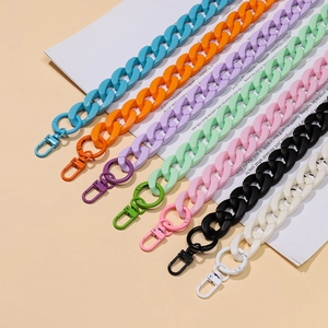 Close-up of colorful acrylic chain straps with matching lobster clasps for handbags