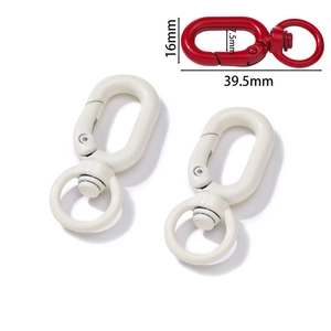 Detail view of colorful swivel lobster clasps with size markings 39.5mm and 16mm
