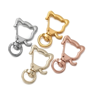 Detailed view of cat-shaped alloy swivel lobster clasps in four metallic color finishes