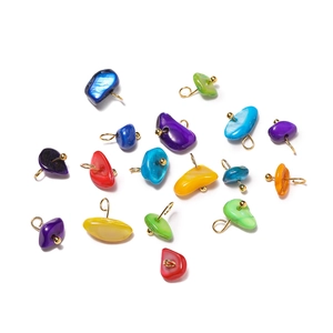 Close-up of colorful natural stone pendants with gold metal rings for DIY jewelry making