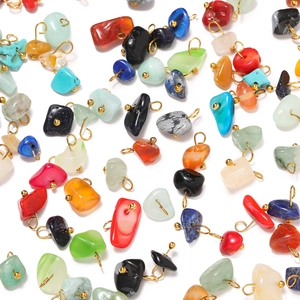 Close-up of irregular natural stone charms with gold metal pins for DIY jewelry making