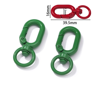 Detail of colorful metal swivel spring hooks with dimension markings in 39.5mm length