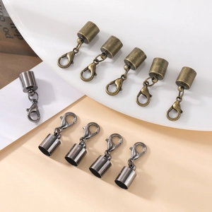 Detailed macro view of lobster clasps with end caps in bronze and gunmetal finish