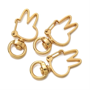 Detailed view of matte gold rabbit-shaped swivel lobster clasps for DIY jewelry making