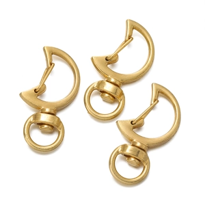 Close-up of three matte gold moon-shaped swivel lobster clasps for DIY jewelry making