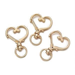 Three golden heart-shaped lobster swivel clasps for DIY jewelry making and keychains