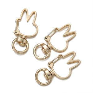 Detail of rabbit shaped metal lobster clasp in light gold finish for DIY jewelry making