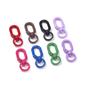 Close-up of eight colorful swivel lobster clasps in matte finish for DIY keychains