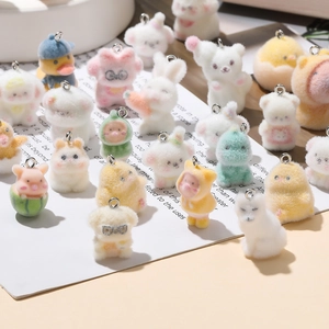Macro detail of assorted flocked animal pendants in pastel colors for DIY crafts