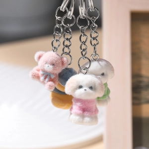 Cute flocked animal keychain pendants featuring pink bear and white dog with silver ring