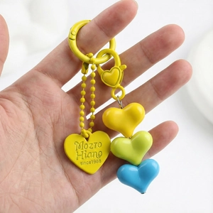 Colorful resin heart keychain with three multi-color charms and metal ring holder