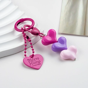 Detail of a colorful heart beaded keychain featuring alloy clips and multi-color resin charms
