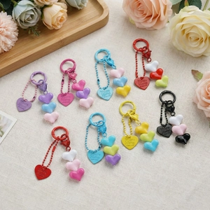 Colorful heart-shaped beaded keychain set in various vibrant resin and alloy designs