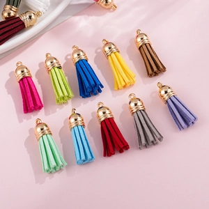 Macro detail of multi-color 3.8cm CCB plastic tassels with golden caps for DIY jewelry