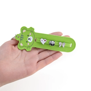 Detail of green leather cartoon animal keychain with panda charm and metal ring