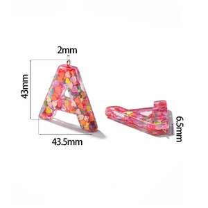 Detail view showing dimensions of resin letter A pendant with colorful heart sequins