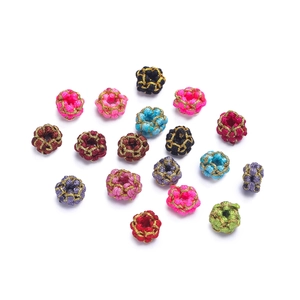 Macro detail of colorful DIY woven knot beads with gold wire thread for jewelry making