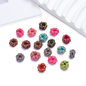 Macro view of multi-color handmade woven knot beads with gold silk wire wrap detailing