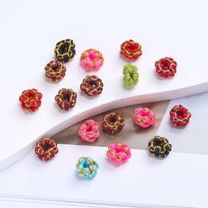Detailed view of colorful handmade DIY woven beads with gold wire for jewelry making