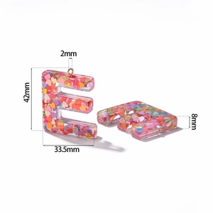 Detail showing dimensions of resin letter E charm with pink heart-shaped sequins