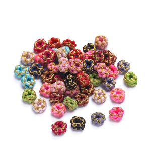 Detailed macro of colorful handmade DIY wire-wrapped beads for braided jewelry making
