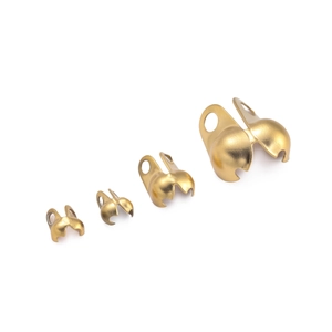 Detailed view of golden stainless steel crimp beads in four sizes for jewelry making