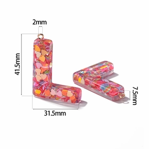 Detailed view of pink resin letter L charms with heart sequins and exact dimensions