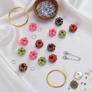 Macro shot of assorted colorful woven silk beads and metallic DIY jewelry components