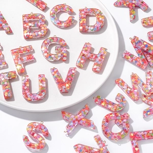 Resin alphabet pendants with colorful heart sequins and metal loops for DIY keychains