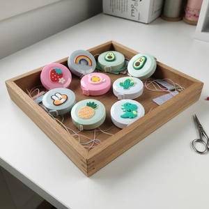 Set of cute cartoon retractable mini tape measures with various colorful animal shapes