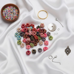 Handmade woven gold wire flower beads in various colors for DIY jewelry making