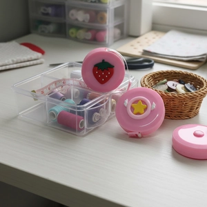 Pink cartoon retractable tape measure for sewing with strawberry and star motifs
