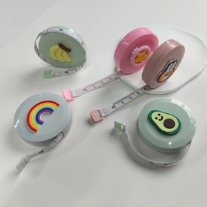 Detail of cute cartoon mini soft measuring tapes in pastel colors with 3D silicone patterns
