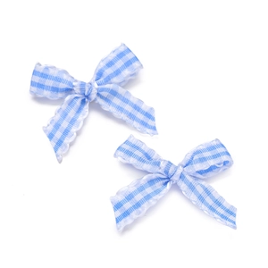 Detail of blue gingham plaid bow ties with scalloped edges for DIY hair accessories