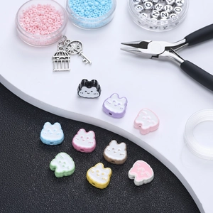 Close-up of assorted colorful cartoon animal beads for DIY jewelry and necklaces