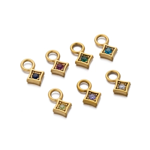 Detailed close-up of colorful round zircon pendants in gold-plated stainless steel settings