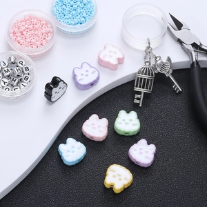 Macro view of cartoon rabbit resin beads and colorful seed bead DIY jewelry making kit