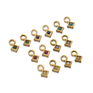 Set of 14 gold-plated square charms with colorful zircon stones on white background