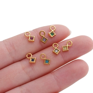Set of six gold-plated diamond-shaped pendants with colorful zircon stones in various colors