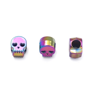Close-up of rainbow skull charms with side holes for DIY jewelry and bracelet making