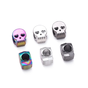 Detailed macro of vintage skull alloy beads in multi-color and silver for DIY jewelry