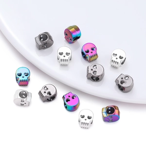 Macro detail of colorful skull-shaped metal beads for DIY jewelry and bracelets
