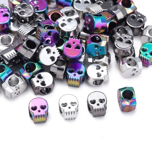 Detailed macro of colorful skull alloy beads for DIY jewelry making in multiple finishes
