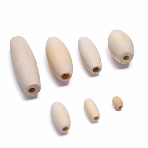 Macro shot of oval wooden beads in various sizes for DIY jewelry and crafts