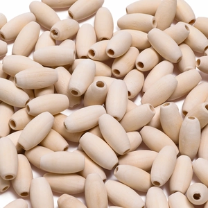 Macro shot of unfinished oval wood beads with natural grain for DIY jewelry making