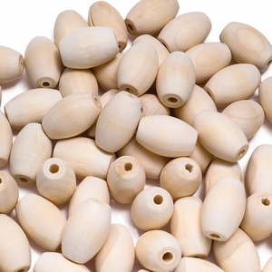 Macro close-up of oval natural wood beads with smooth grain and pre-drilled holes for DIY