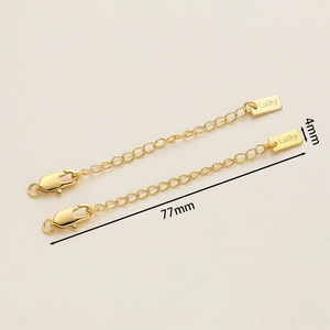 Detail of 18K gold plated extension chain with lobster clasp and Lucky tag