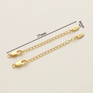 Close-up of 18K gold-plated necklace extension chains with lobster clasp and tag