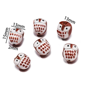 Detail showing dimensions of owl ceramic bead 15mm by 13mm with 2mm hole for DIY jewelry