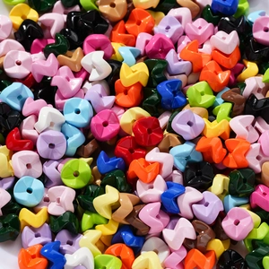 Macro shot of colorful wave-shaped acrylic beads for DIY jewelry and phone chain making